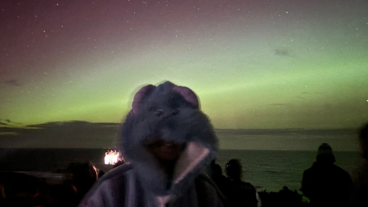 Yuchen Luo beneath the aurora